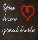 Neon sign with the phrase "You have great taste" featuring a red heart, promoting the CURSO VINOS: Rioja Vs Ribera Vs Priorat. Junio 25. event.